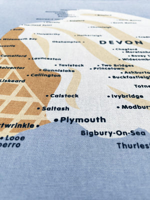 Close up of the Devon and Cornwall Ice Cream Map design, screenprinted onto cotton, showing some of the placenames and the fabric texture.  