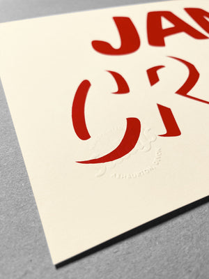 Close up of cleanly printed type in strawberry red ink on a cream coloured recycled card stock, reading CREAM across the bottom with JAM written on top! Embossed Salty’s branding in the bottom left corner.